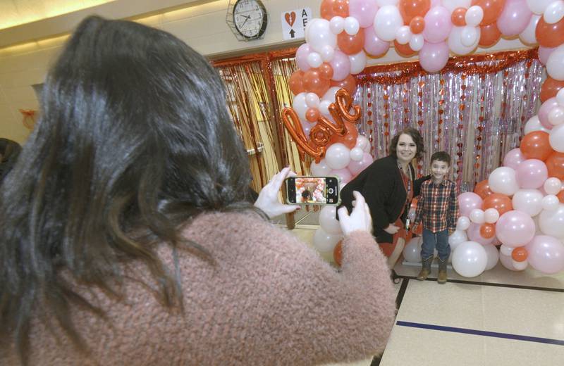Students were able to have their photos taken with faculty during a Valentine's Family Fun Day event Friday, Feb. 14, 2025, at Lincoln Elementary School in Ottawa.