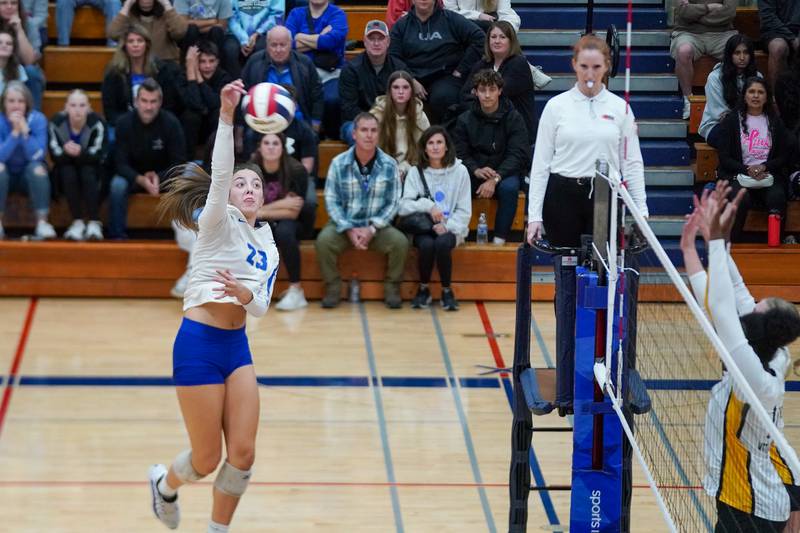 St. Charles North's Haley Burgdorf (23) goes up for a kill attempt against Metea Valley during a Class 4A West Aurora Sectional semifinal volleyball match at West Aurora High School on Tuesday, Nov. 5, 2024.
