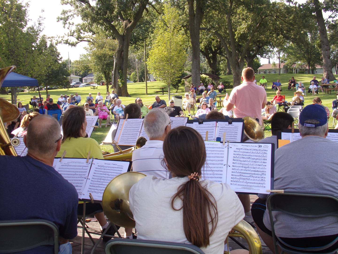 Spectators sat in lawn chairs and on blankets across the lawn of Centennial Park on Sunday, July 31, 2022, to watch SUMMERTUBAFEST.