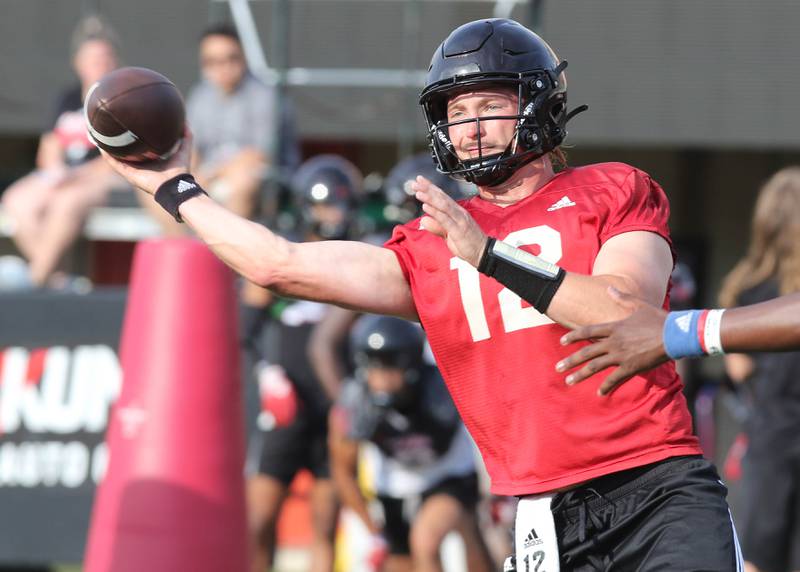 Northern Illinois Huskies quarterback Rocky Lombardi throws a pass during a drill at the first practice of the season Wednesday, Aug. 2, 2023, at Huskie Stadium in DeKalb.
