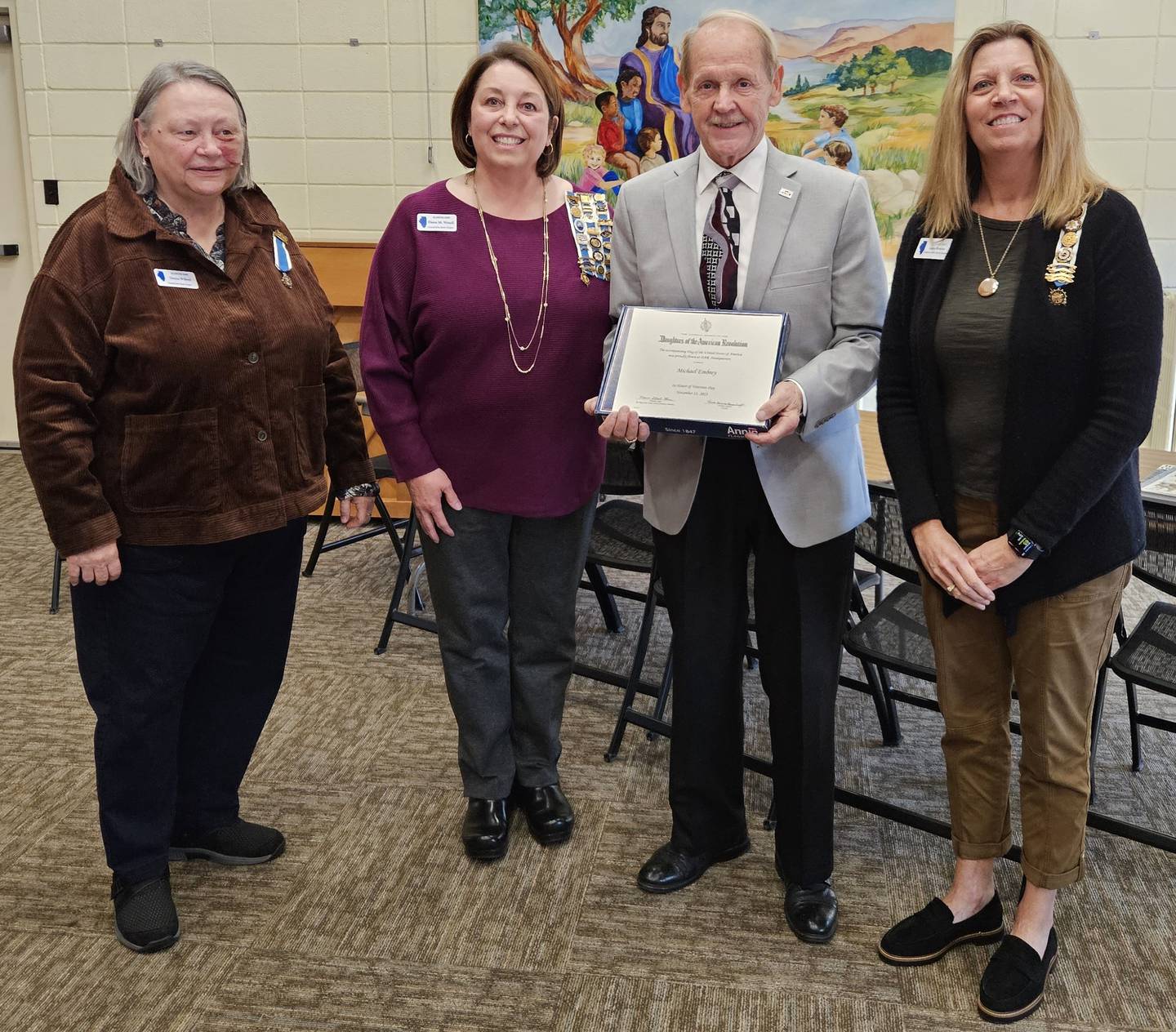 (Left to right); DAR General John Stark Chapter Regent Donna Willrett, chapter member Dawn Wexell, Michael Embrey, and chapter member Angie Brandt