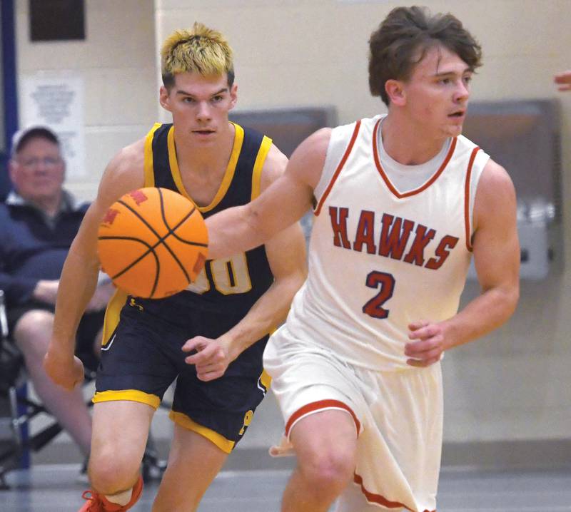 Oregon's Cooper Johnson (2) dribbles up the court as Polo's JT Stephenson (00) focuses on the ball during a Friday, Dec. 5, 2025 game at the Blackhawk Center in Oregon.