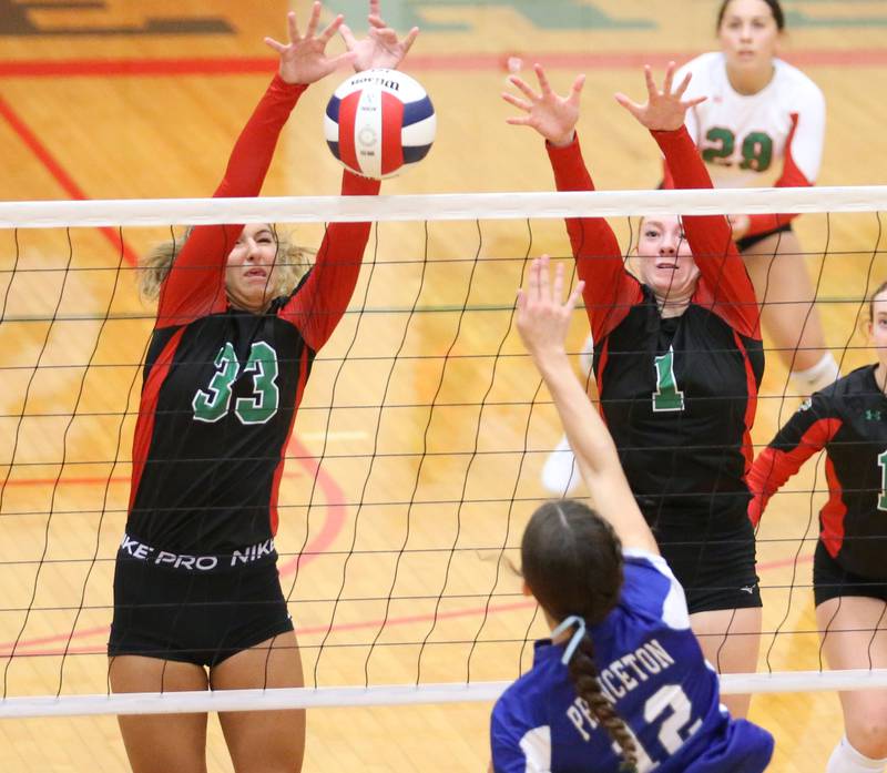 L-P's Kesley Fredrick blocks a kill with teammate Addison Duttlinger against Princeton's Chrissy Sierens on Tuesday, Aug. 22, 2023 in Sellett Gymnasium.