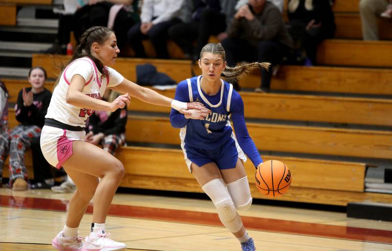 Wheaton North’s Adeline Sutton dribbles past Batavia’s Hallie Crane during a game on Wednesday, Jan. 29, 2025 at Batavia.