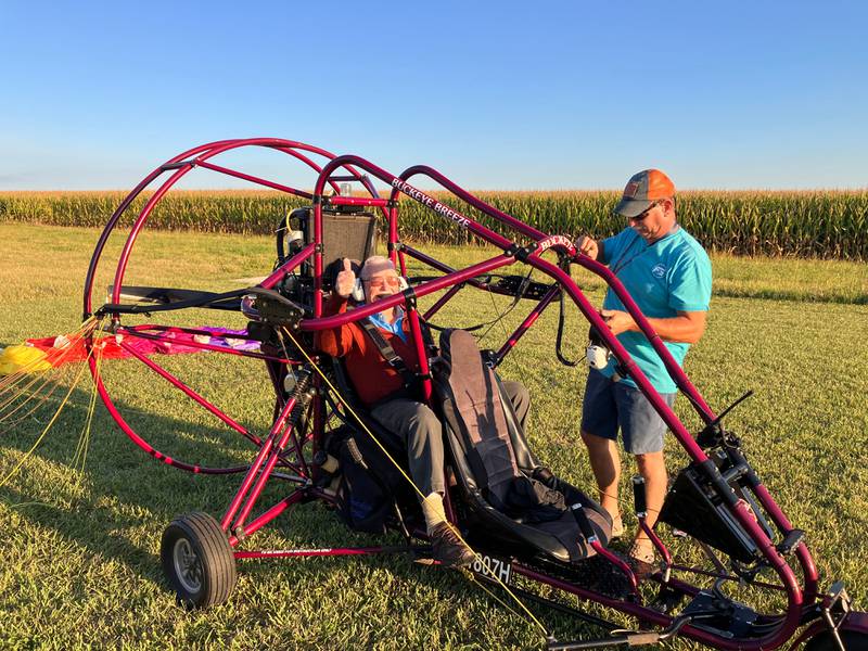 Willard Simpson gives a thumbs up while strapped into an ultralight aircraft on Monday near Ashton. The pilot, Keith Stranberg of Oregon, gave Simpson a ride in the aircraft Monday to celebrate his 100th birthday.