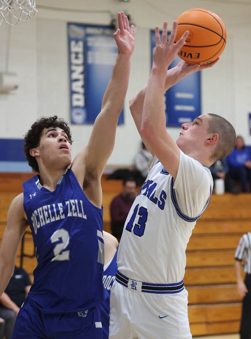 Hinckley-Big Rock's Jacob Orin shoots over Rochelle Zell’s Ronen Ousley during their game Tuesday, Dec. 17, 2024, at Hinckley-Big Rock High School.