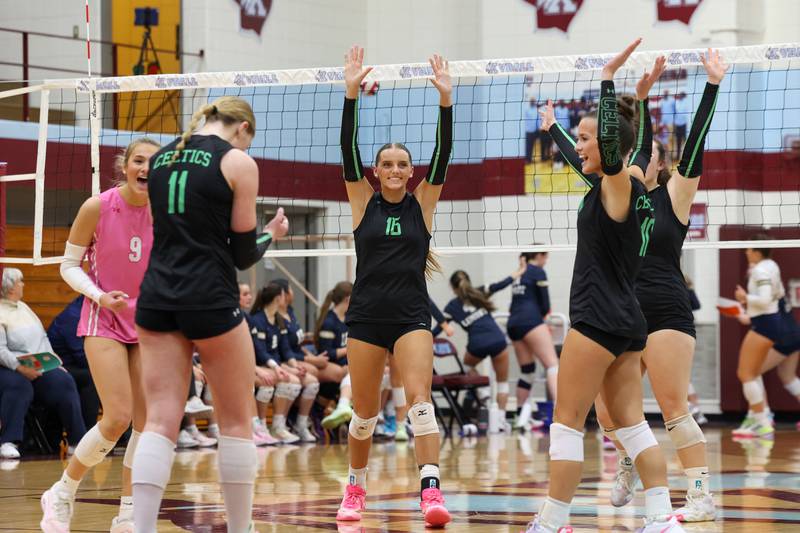 Providence's Cali Tierney, center, turns to celebrate a point with teammates during Providence's victory in two sets, 25-25, 25-18, over Lemont in the IHSA Class 3A Kankakee Sectional championship on Thursday, Nov. 6, 2025.