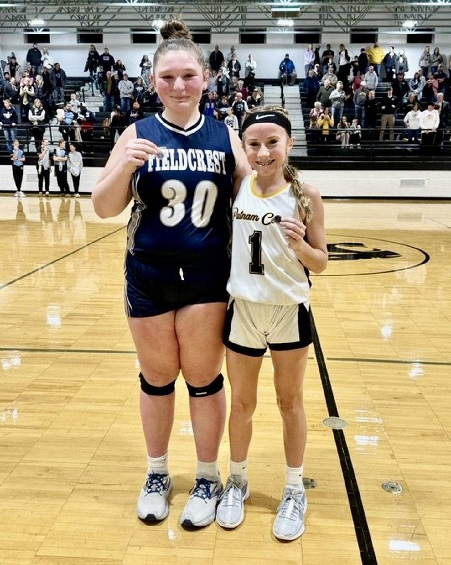 Putnam County Jr. High's Anni Judd (right) was selected as an IESA Sportsmanship winners for the 8th Grade Girls Regional Championship.