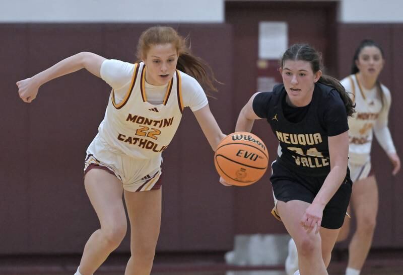 Montini’s Audrey Kinney leads Neuqua Valley’s Nalia Clifford up court in a girls basketball game at Montini Catholic High School in Lombard Monday.