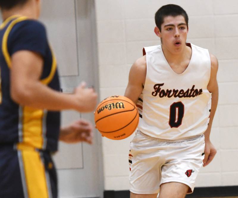Forreston's Joseph Kobler (0) brings the ball up the court against Polo on Saturday, Dec. 13, 2025 at the 64th Annual Forreston Holiday Basketball Tournament held at Forreston High School.