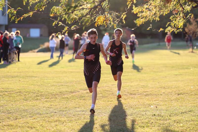 Bradley-Bourbonnais' Luca Nims and Mathias Barmann near the finish line in seventh and eighth place respectively in the boys 3-mile race during All-Area Cross Country meet on Wednesday, Oct. 8, 2025, at Kankakee Community College.