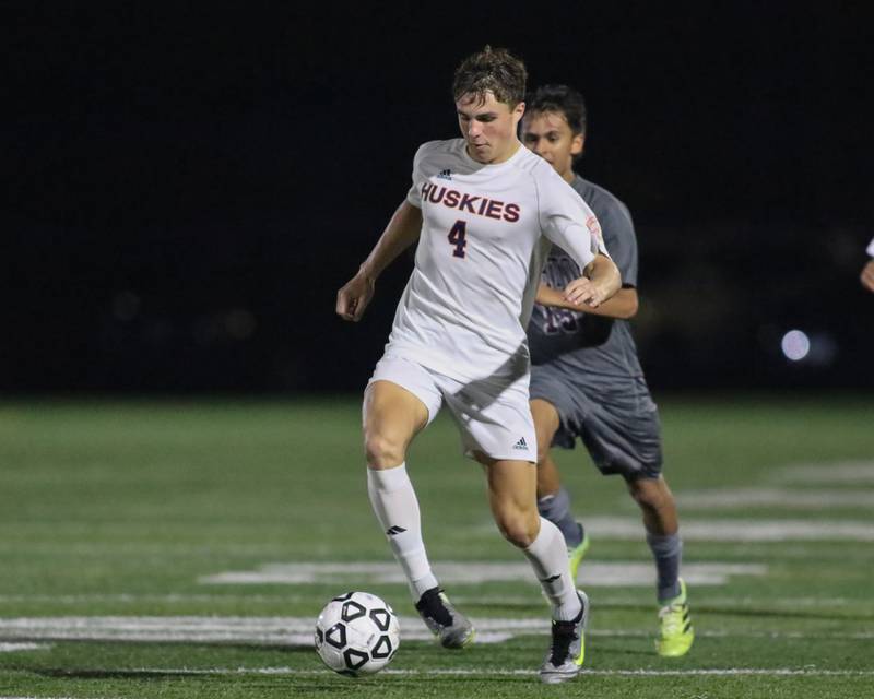 Naperville North's Connor Hanrahan (4) advances the ball during soccer match between Naperville North at Morton.  Sept 21, 2023.