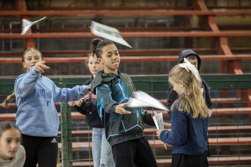 Madison School fifth graders toss paper airplanes at the agriculture drone workshop Friday, April 25, 2025, at Ag Expo in Amboy.