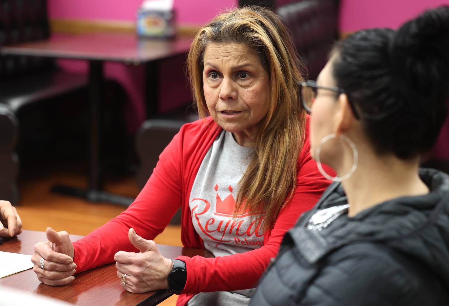 Maria Caudillo, from Reyna's Peluqueria in DeKalb, talks about her reasons for participating in a Day Without Immigrants Monday, Feb. 3, 2025, during a meeting at Flamingo Restaurant & Ice Cream in DeKalb. More than 30 DeKalb County businesses closed on Monday to show solidarity in their stance against President Donald Trump’s anti-immigration policy.