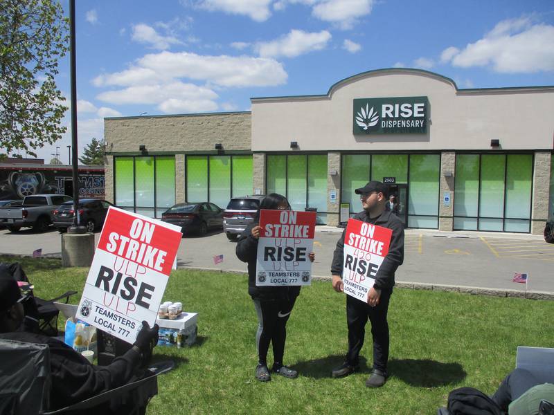 Striking workers stand outside the Rise cannabis dispensary at 2903 Colorado Ave., Joliet on Wednesday, April 26, 2023.