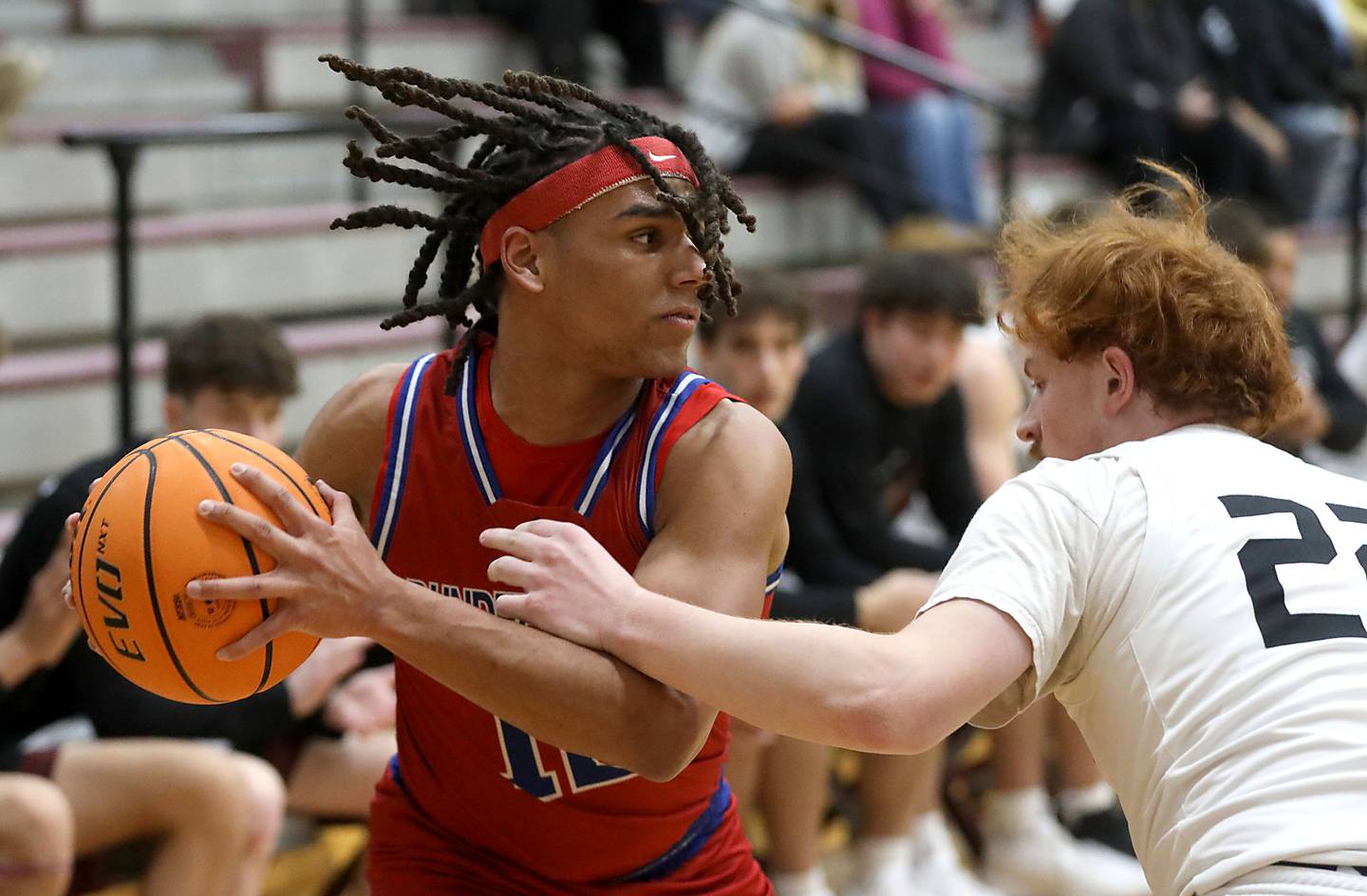 Dundee-Crown's Anthony Spain looks to pass as he is guarded by Prairie Ridge's Johnny Kemp during a Fox Valley Conference boys basketball game on Friday, Jan. 16, 2026, at Prairie Ridge High School in Crystal Lake.
