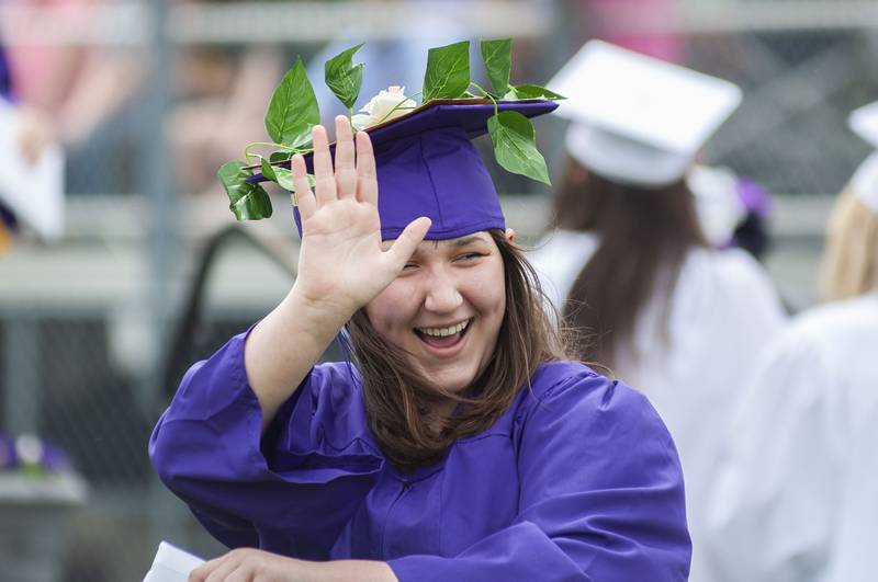 Clarice Williar waves to friends after getting her diploma Sunday, May 29, 2022 during Dixon High School’s graduation.