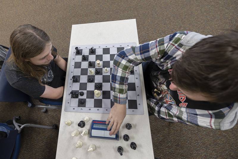 August Kuehl, left, and Brandeis Shore work at chess practice Wednesday, Jan. 25, 2023 at Sterling High School. The No. 1-seeded team will be competing at IHSA sectional on Saturday in Rockford.