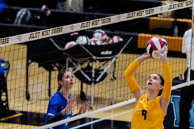 Joliet West's Julia Adams approaches the net against Lincoln-Way East during a Varsity Volleyball match at Joliet West on Aug. 26, 2025.
