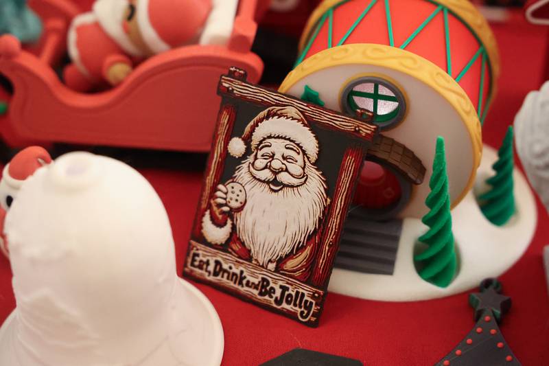 3D printed holiday decorations sit on a table at the North Pole Christmas Market inside the Renaissance Center at the Joliet Light Up the Lights Holiday Festival on Friday, Nov. 29, 2024.