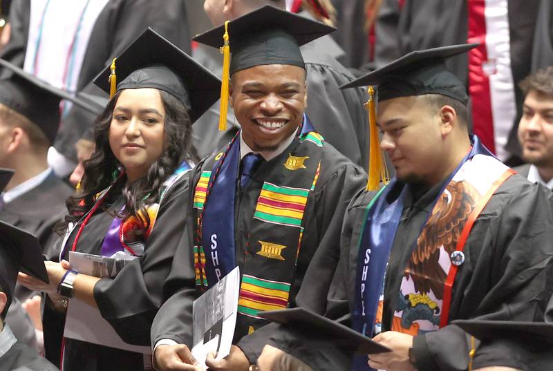 Graduation candidates have some fun during the ceremony in the Convocation Center Saturday, May 14, 2022, during the first of two undergraduate commencement ceremonies at Northern Illinois University in DeKalb.