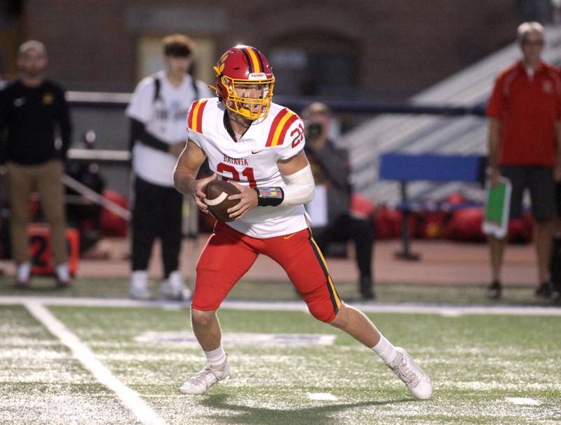 Batavia quarterback Ryan Boe looks to pass the ball during a game at St. Charles North on Friday, Sept. 15, 2023.