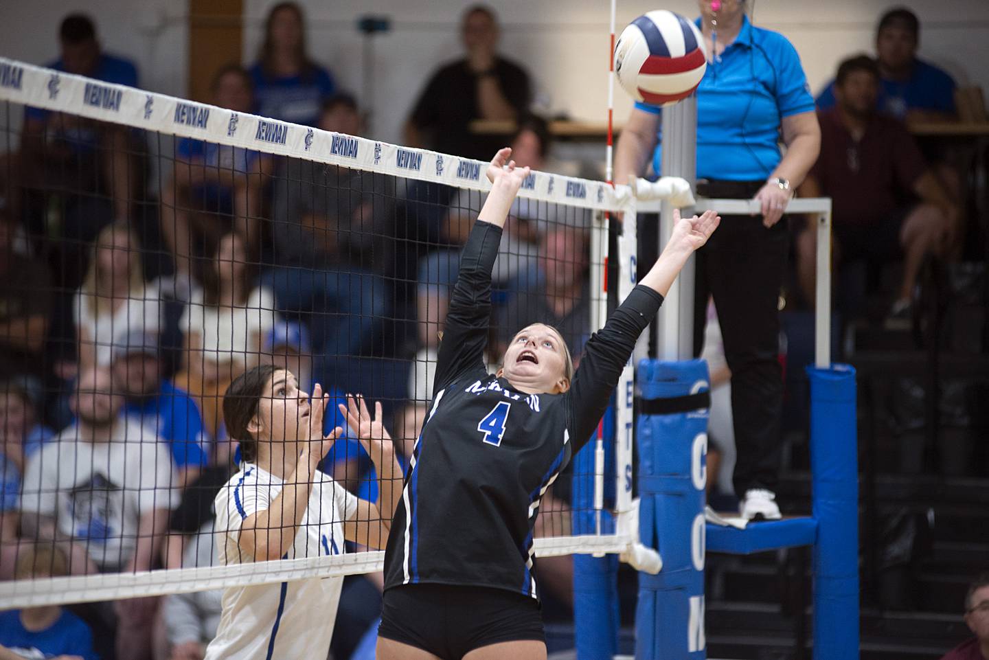Newman’s Katie Grennan sets the ball Thursday, Sept. 15, 2022 against Princeton.