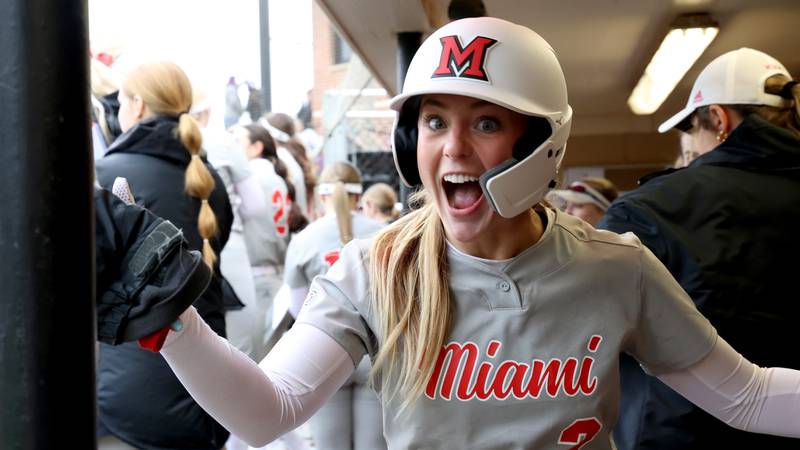 Miami Ohio's Jenna Golembiewski, a Marian Central graduate, celebrates in the dugout Feb. 9, 2024, at Hunt Softball Park in Elon, North Carolina.