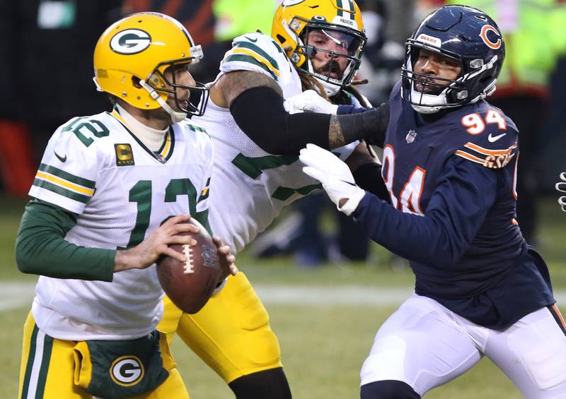 Chicago Bears linebacker Robert Quinn (94) gets pressure on Green Bay Packers quarterback Aaron Rodgers (12) during their game Sunday at Soldier Field in Chicago.