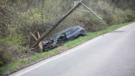 Car crashes into utility pole in Woodstock, shutting down road