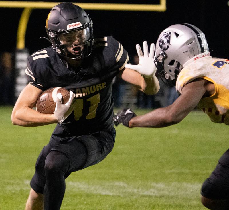 Sycamore's Burke Gautcher (11) runs after the catch against Kaneland during a football game at Kaneland High School in Maple Park on Friday, Sep 30, 2022.