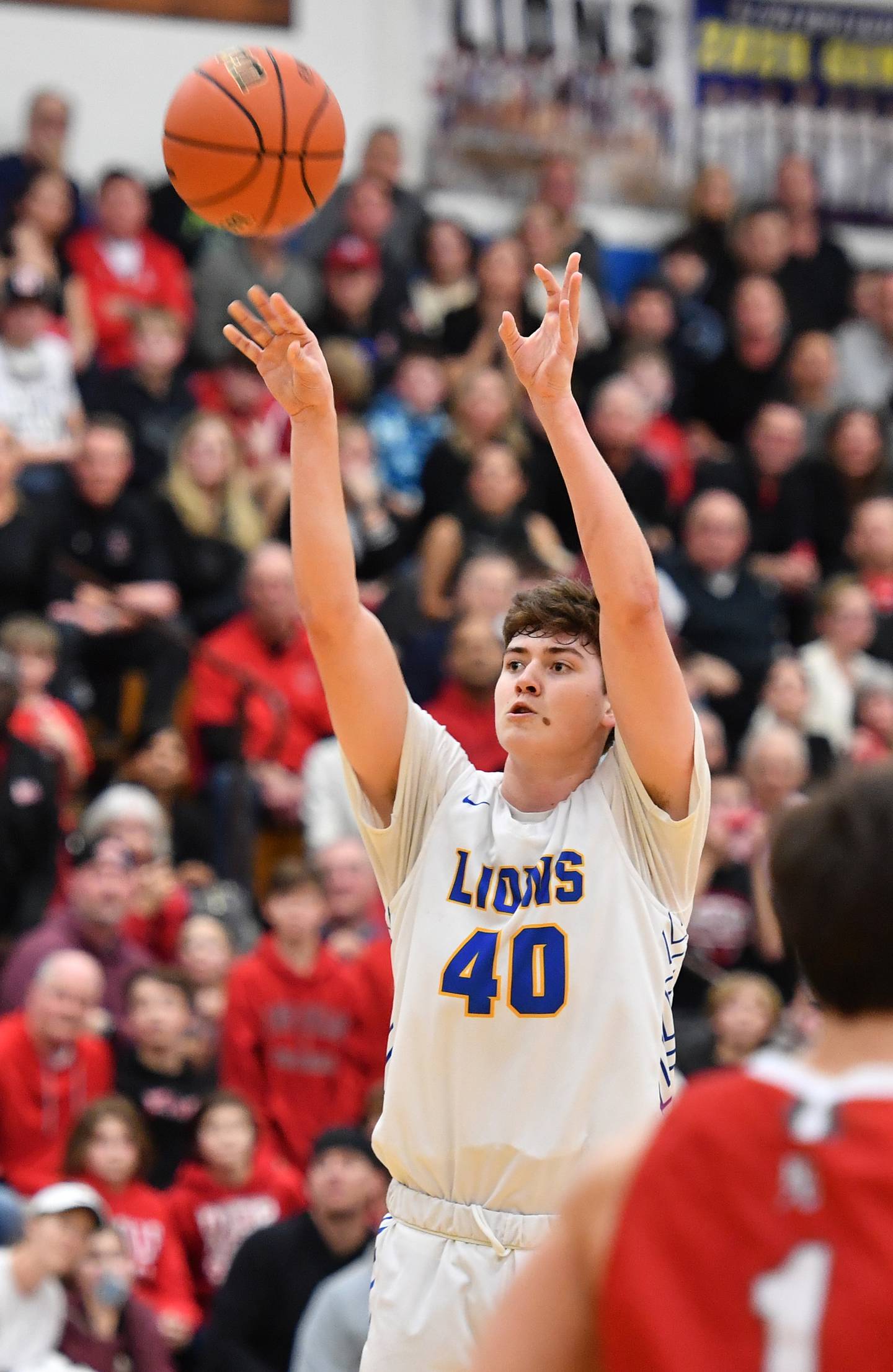 Lyons Township's Brady Chambers (40) shoots for three points during a game against Hinsdale Central on Feb. 11, 2023 at Lyons Township High School in LaGrange.