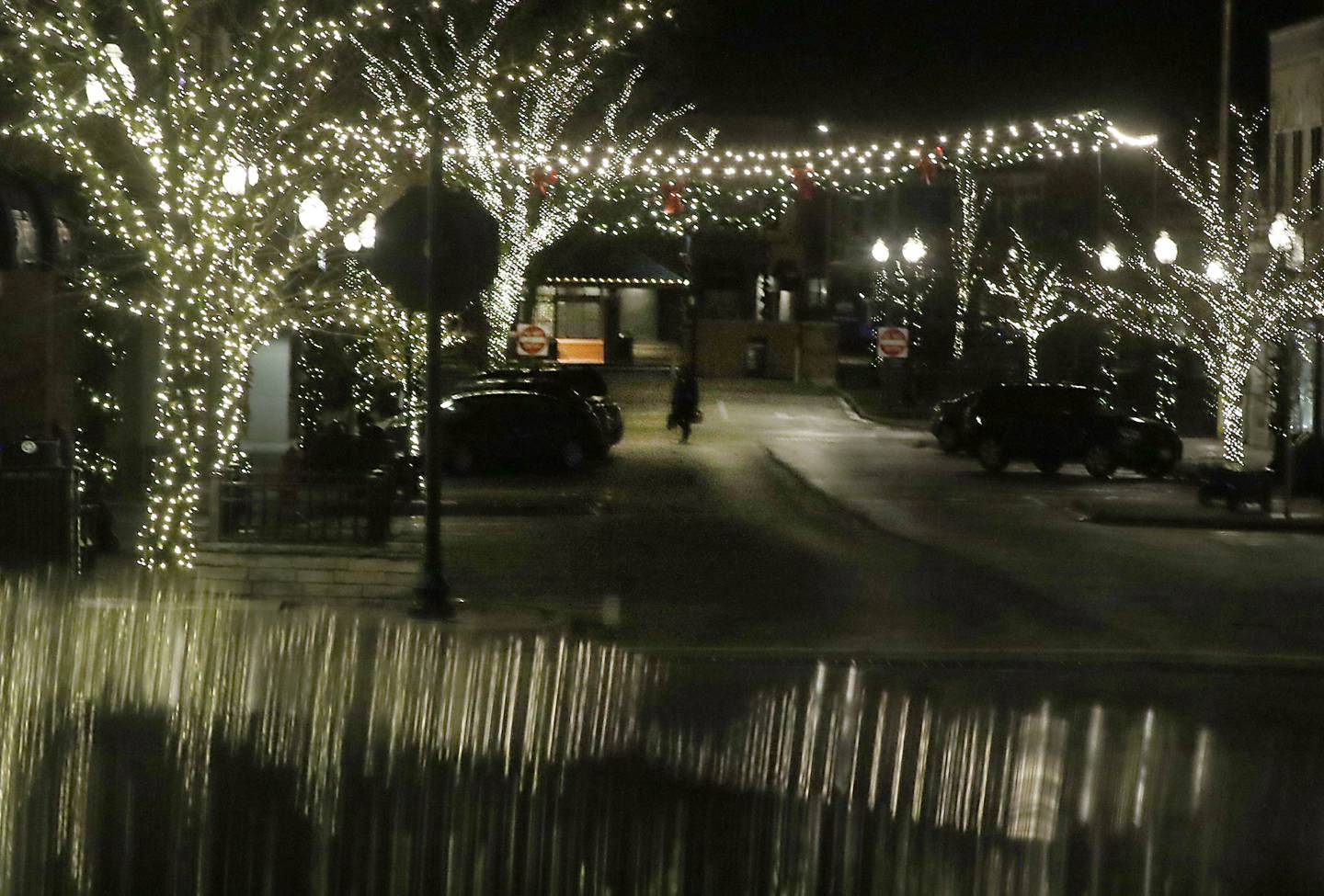 A pedestrian crosses North Williams Street in Crystal Lake amid the holiday lights on Tuesday, Nov. 29, 2022. While the Christmas season may be happy and joyful for a lot of people, this can be a really hard time of year for people who at struggling with depression, anxiety, grief, and substance abuse.