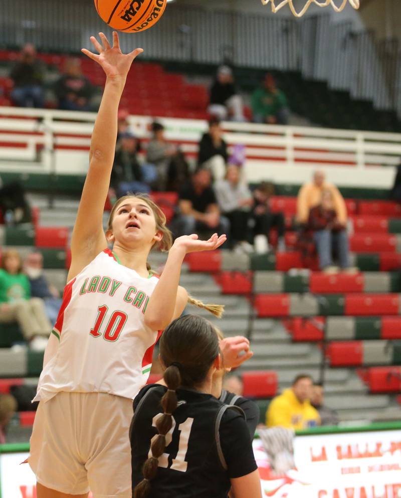 L-P's Kelsey Frederick lets go of a shot over Kaneland's Kyra Lilly on Wednesday, Jan. 15, 2025 in Sellett Gymnasium at L-P High School.