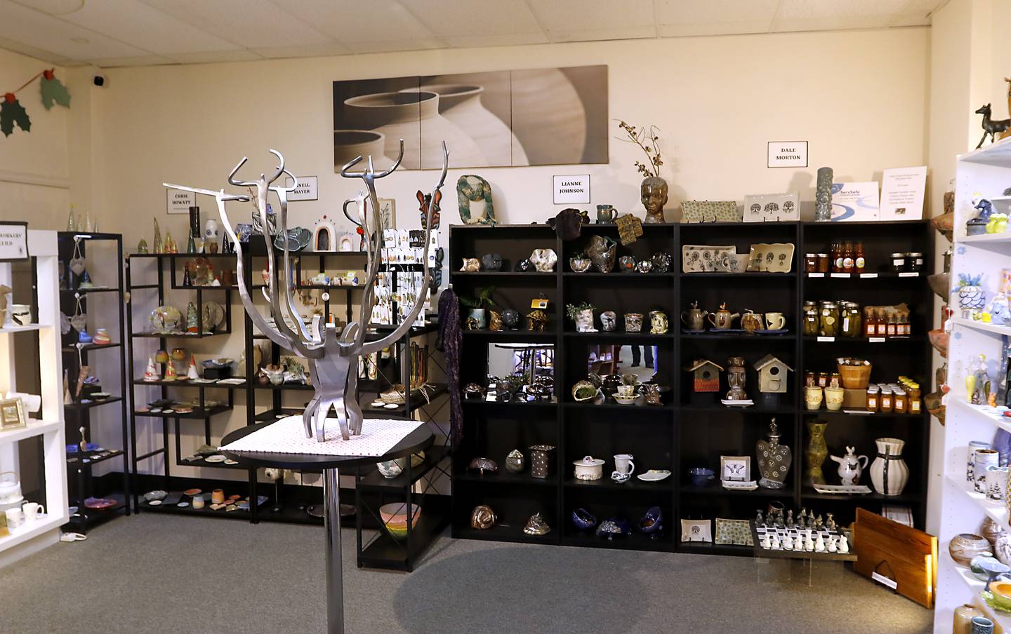 Clayworkers' Guild of Illinois is expanding their Artisans on Main gallery into a neighboring space behind their Woodstock location. The space, that was formerly the “Woodstock Tobacco Hub, will house the guild's classroom space. A doorway to the new space will be installed int the back wall of the current space.