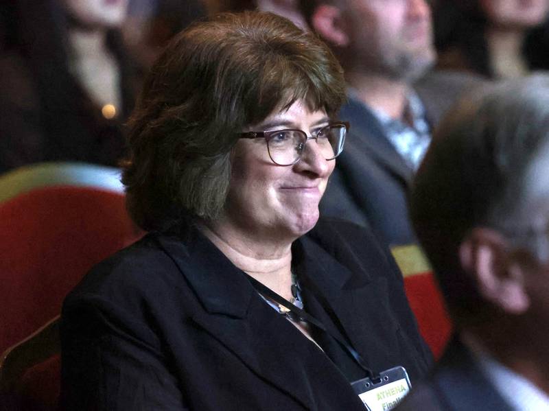 Linda Sherman, an Athena Award finalist, smiles as she listens to her presenter and daughter Katie Sherman talk about her and why she is deserving to be nominated Thursday, Oct. 16, 2025, during the 35th annual Athena and Women of Accomplishment Award Reception at the Egyptian Theatre in DeKalb.