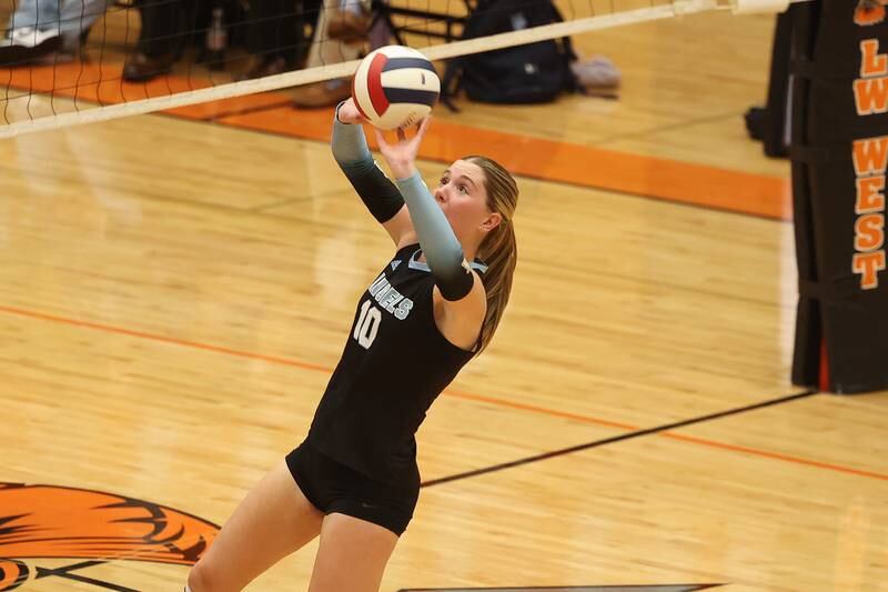Joliet Catholic’s Olivia Emerson keeps the volley alive against Plainfield South in the Class 4A Lincoln-Way West Regional semifinal on Tuesday, Oct. 29, 2024 in New Lenox.