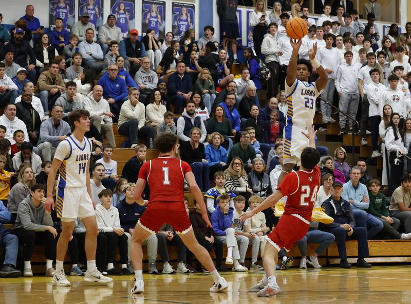 Lyons Township's Blake Ragsdale (23) puts up a shot during a varsity basketball game between Hinsdale Central and Lyons Township high schools on Friday, Dec. 12, 2025 in La Grange.
