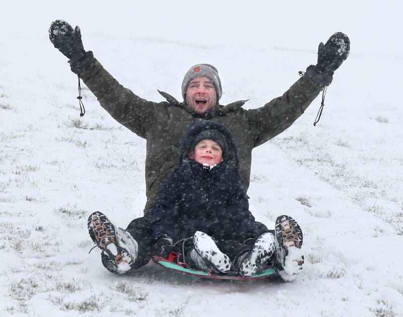 Mike Patersy, and his son Myles, 6, from Sycamore, have some fun Saturday, Nov. 29, 2025, on the Northwestern Medicine Sled Hill near the Sycamore Park District Community Center.