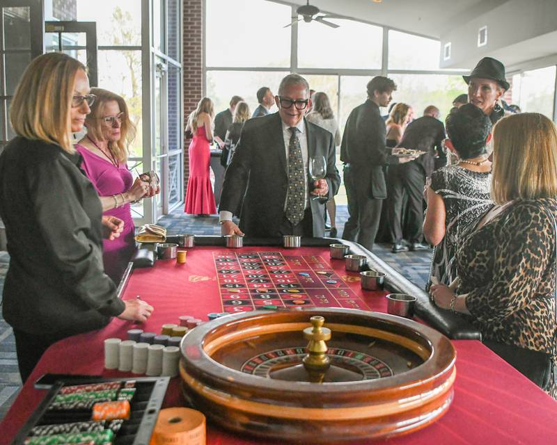 Attendees play the roulette table on Friday May 1, 2026, at the St. Charles Area Chamber of Commerce Charlemagne Awards dinner on Friday, May 1, 2026, held at Royal Fox Country Club in St. Charles.