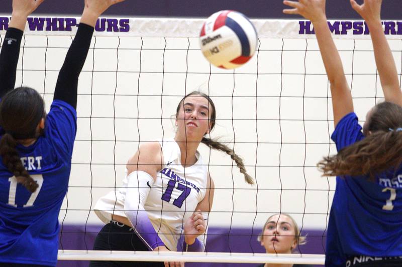 Hampshire’s Melissa Johnson sends the ball over the net against Woodstock in varsity volleyball tournament action on Saturday, Sept. 21, 2024, at Hampshire High School in Hampshire.