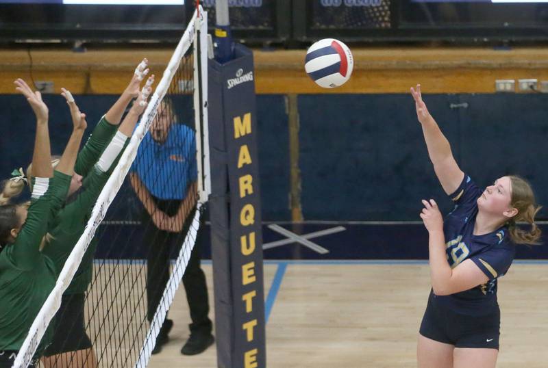 Marquette's Kelsey Cuchra spikes the ball past St. Bede on Thursday, Sept. 4, 2025 at Bader Gym.