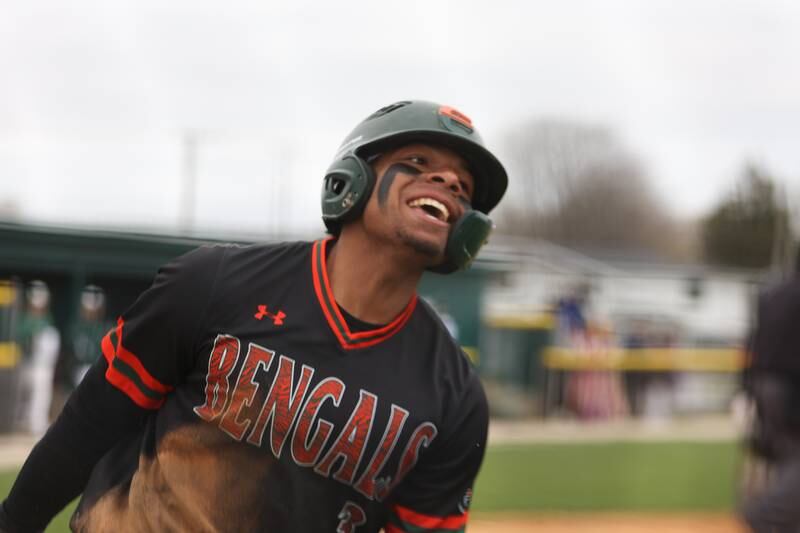 Plainfield East’s Christian Mitchelle celebrates after stealing home against Plainfield Central. Monday, April 25, 2022, in Plainfield.