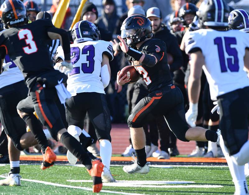 Lincoln-Way West's Joey Campagna runs the ball near the sideline during an IHSA Class 7A quarterfinal game against Downers Grove North on Nov. 11, 2023 at Lincoln-Way West High School in New Lenox.