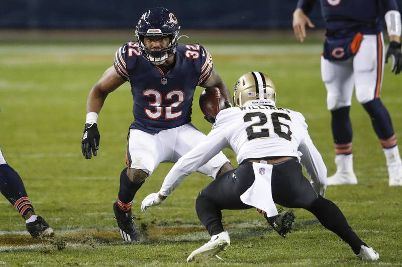 Chicago Bears running back David Montgomery (32) is defended by New Orleans Saints cornerback P.J. Williams (26) during the second half of an NFL football game, Sunday, Nov. 1, 2020, in Chicago. (AP Photo/Kamil Krzaczynski)