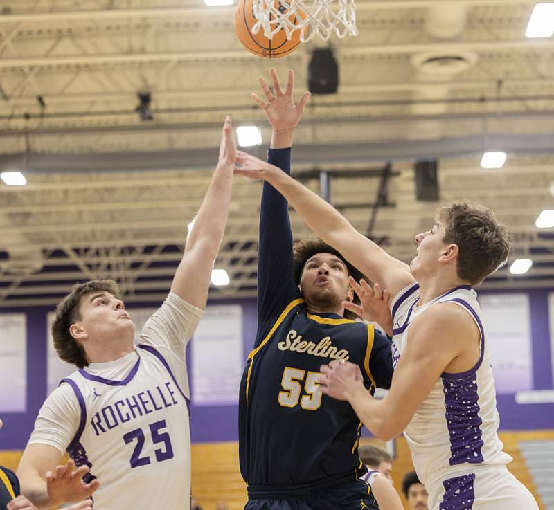 Sterling’s AJ Coleman puts up a shot against a pair of Rochelle defenders Saturday, Jan. 3, 2026.