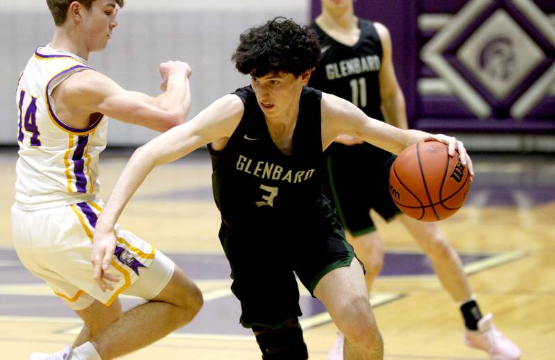 Glenbard West’s Bennett Schwanke drives toward the basket during a game at Downers Grove North on Friday, Jan. 13, 2023.