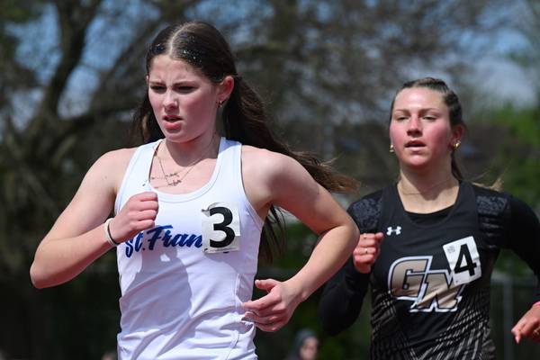 St. Francis, paced by distance wins, takes fourth at Schaumburg Invitational