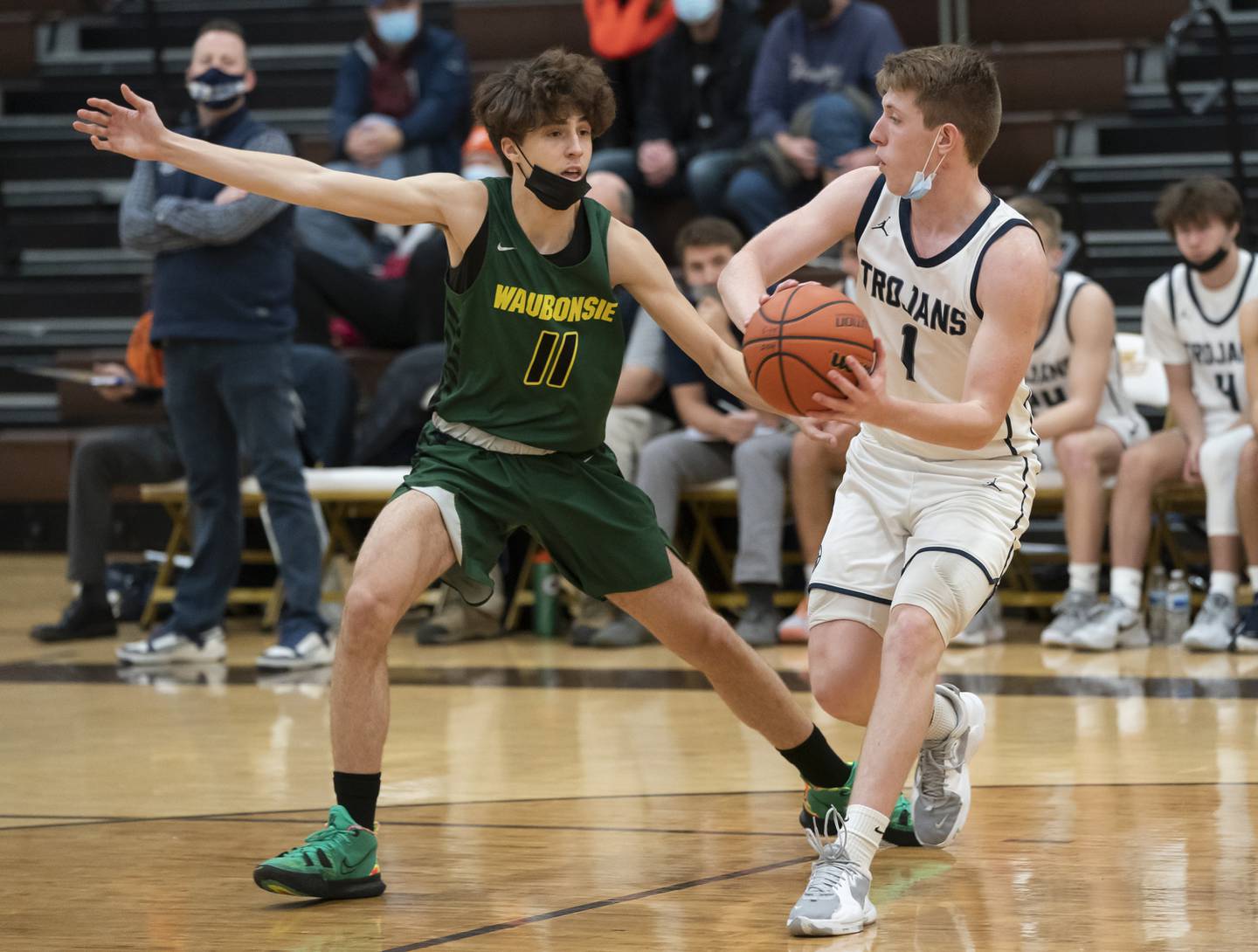 Cary-Grove's Mike Clarke looks to pass past Waubonsie Valley defender Eric Chtilianov during their game at the Hinkle Holiday Classic basketball tournament on Monday, December 27, 2021 at Jacobs High School in Algonquin.