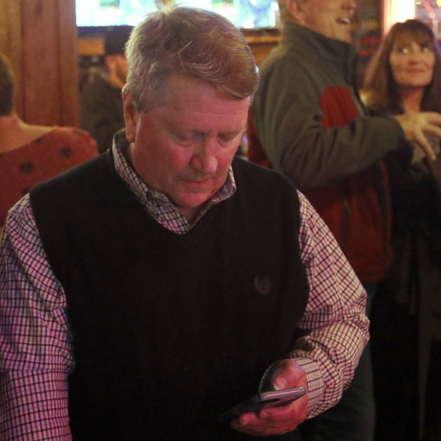 Crystal Lake's City Council candidate Brett Hopkins checks election results during an election watch party for Crystal Lake Mayor Haig Haleblian and candidates for Crystal Lake's City Council at the Cottage Tuesday, April 4, 2023, in Crystal Lake.